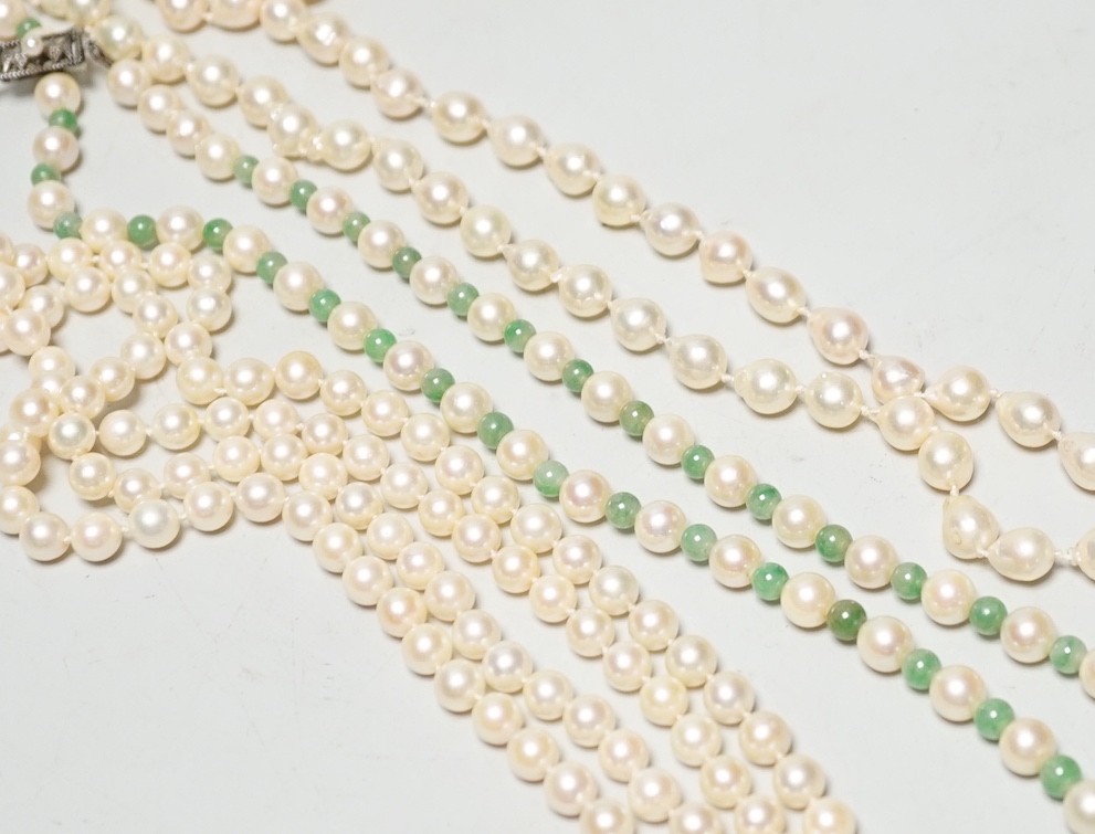 A Mikimoto single strand cultured pearl and green quartz? bead necklace, with white metal and cultured pearl set clasp, 55cm and two other cultured pearl necklaces.